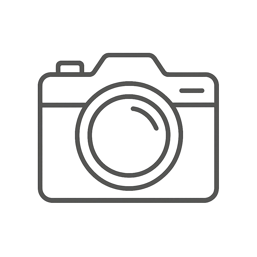 A black outline of a digital camera with a lens, and a small flash or viewfinder in the upper right corner.